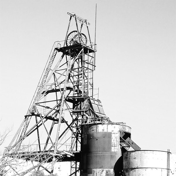 Picture of a mine head frame, complete with winding gear.